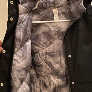 Black Ivivva puffy jacket! Great for wet and cold weather.  Brand new condition!